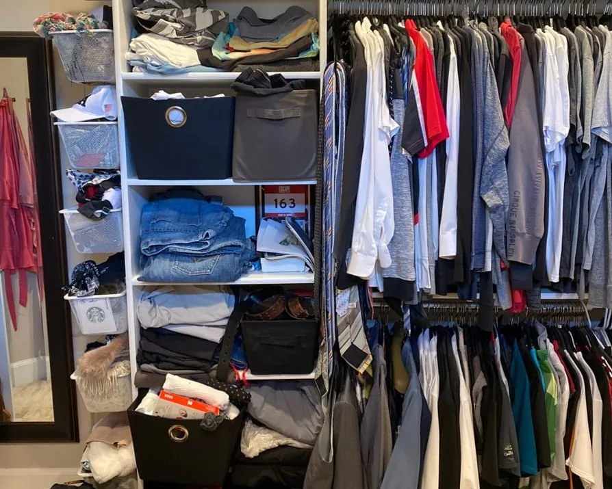 Before: the same closet with folded clothes piled on its shelves and garments crowded on its rails